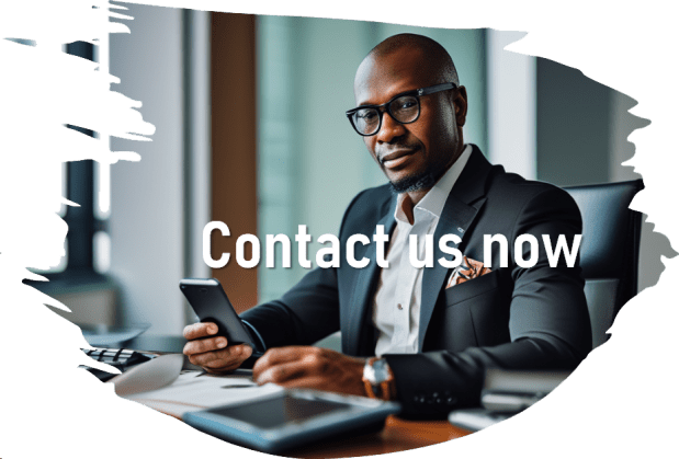 A professional man in a suit, sitting at a desk and holding a smartphone, with a text overlay that says 'Contact us now.'